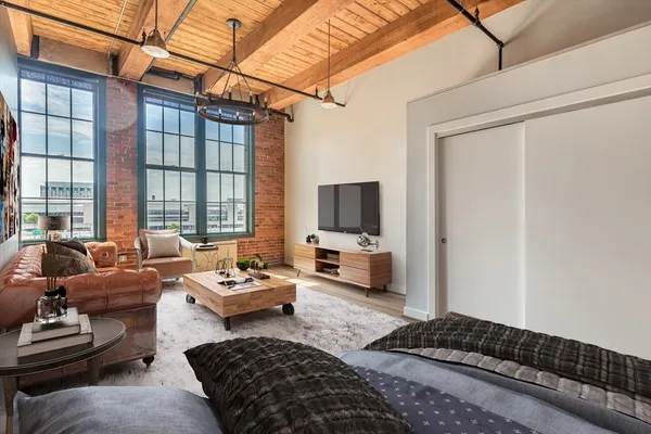 a bedroom with furniture and a window