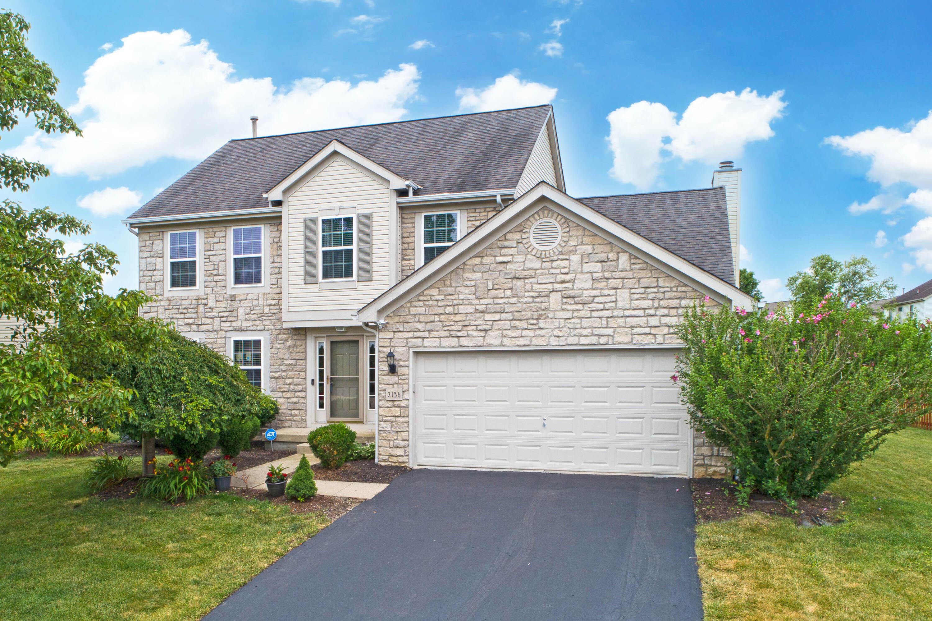 2136 Reeves Avenue Lewis Center, OH 43035 - Photo 23 of 57 • 2 car attached • Attic access • Ventilated shelving • New electric door opener ~ 2021 • Service door •Water spigot