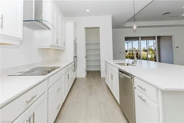 a view of a kitchen with a sink