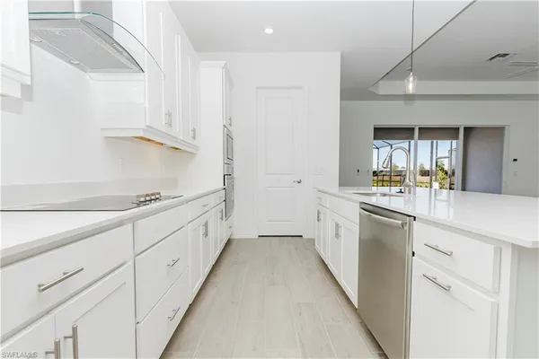 a view of a kitchen with a sink