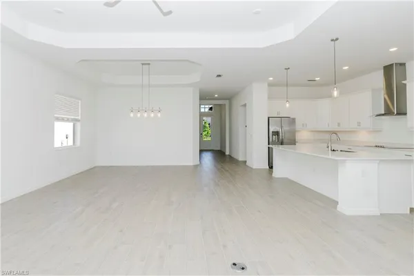 a view of an empty room with a fireplace