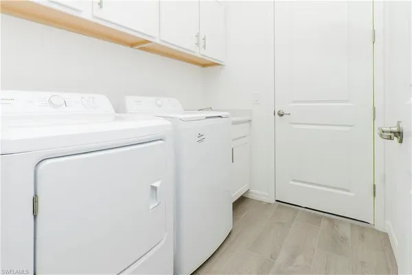 an empty room with a window and closet