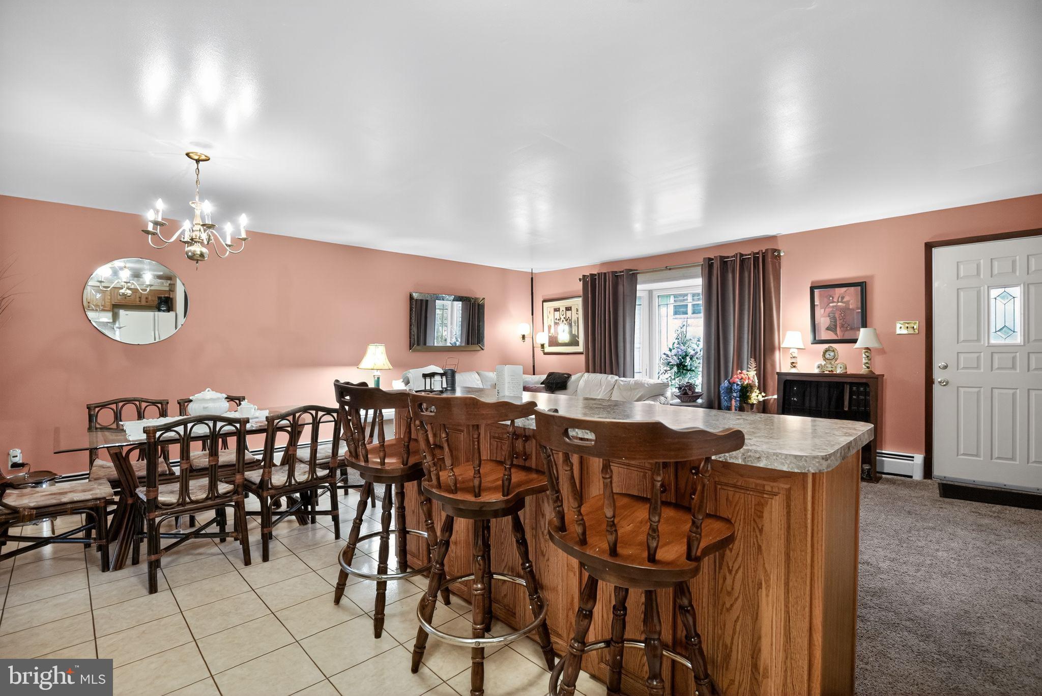 908 Pershing Road Blue Bell, PA 19422 - Photo 12 of 24 a view of a dining room with furniture and chandelier
