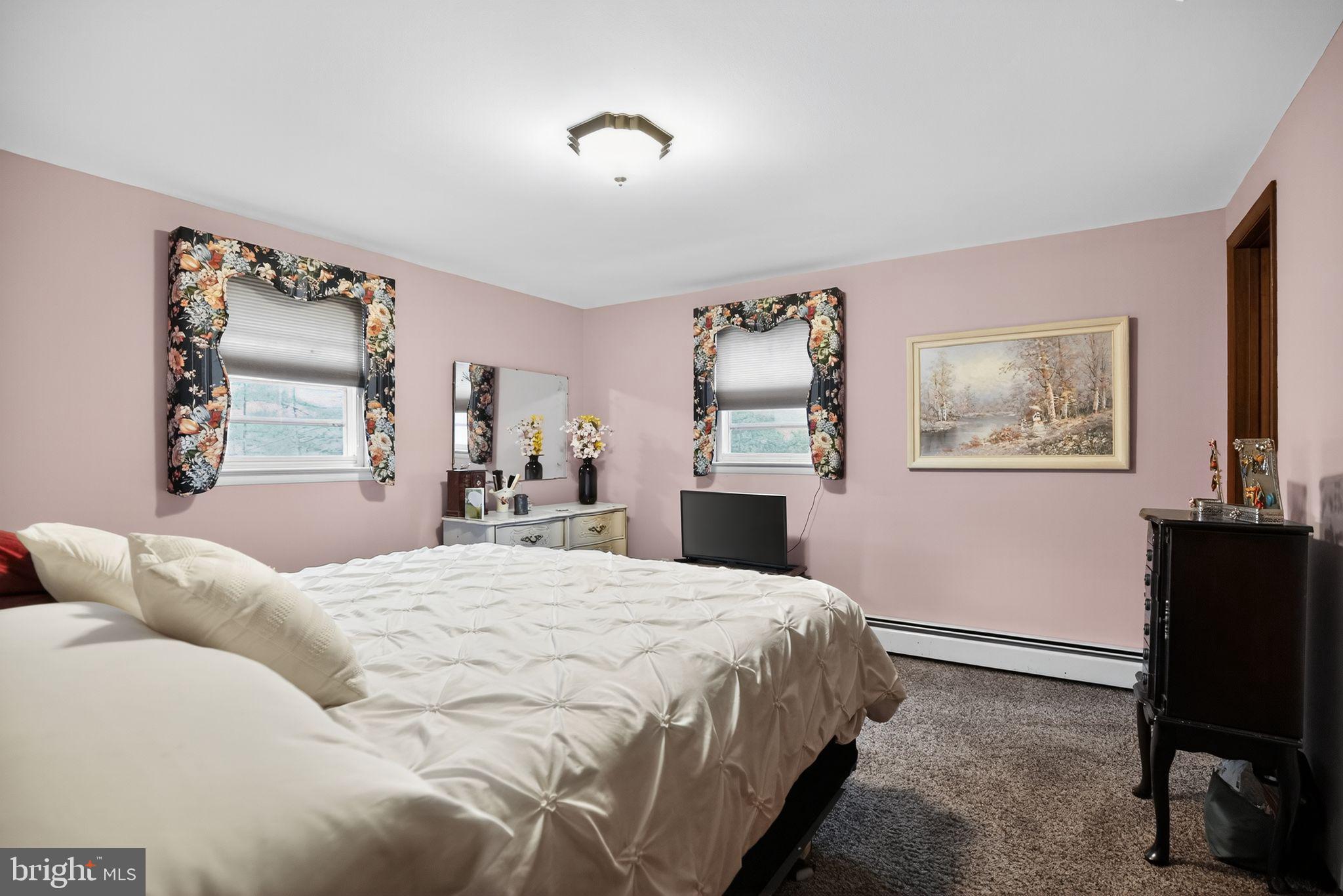 908 Pershing Road Blue Bell, PA 19422 - Photo 17 of 24 a bedroom with a bed and a desk