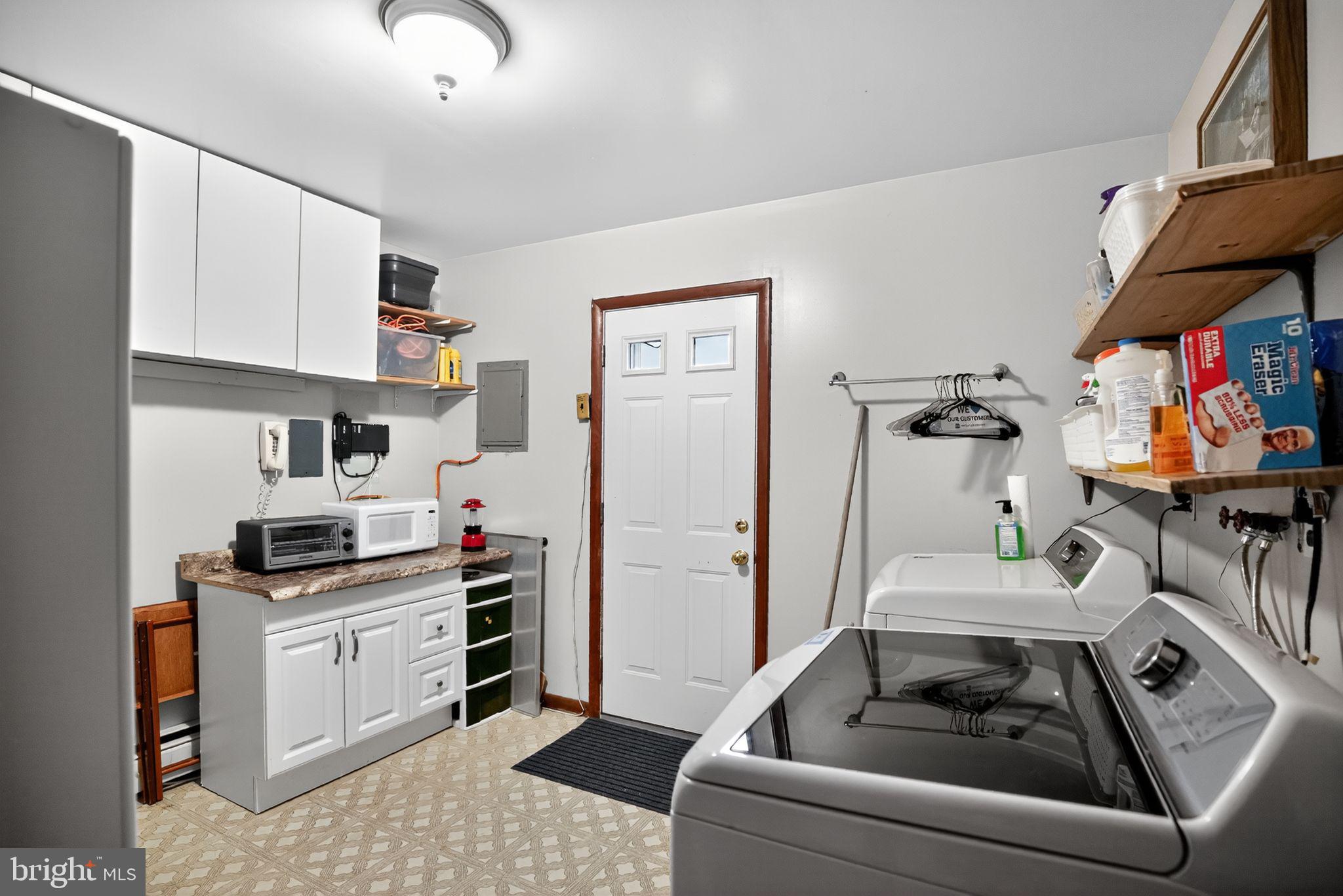 908 Pershing Road Blue Bell, PA 19422 - Photo 22 of 24 a kitchen with a stove cabinets and a refrigerator