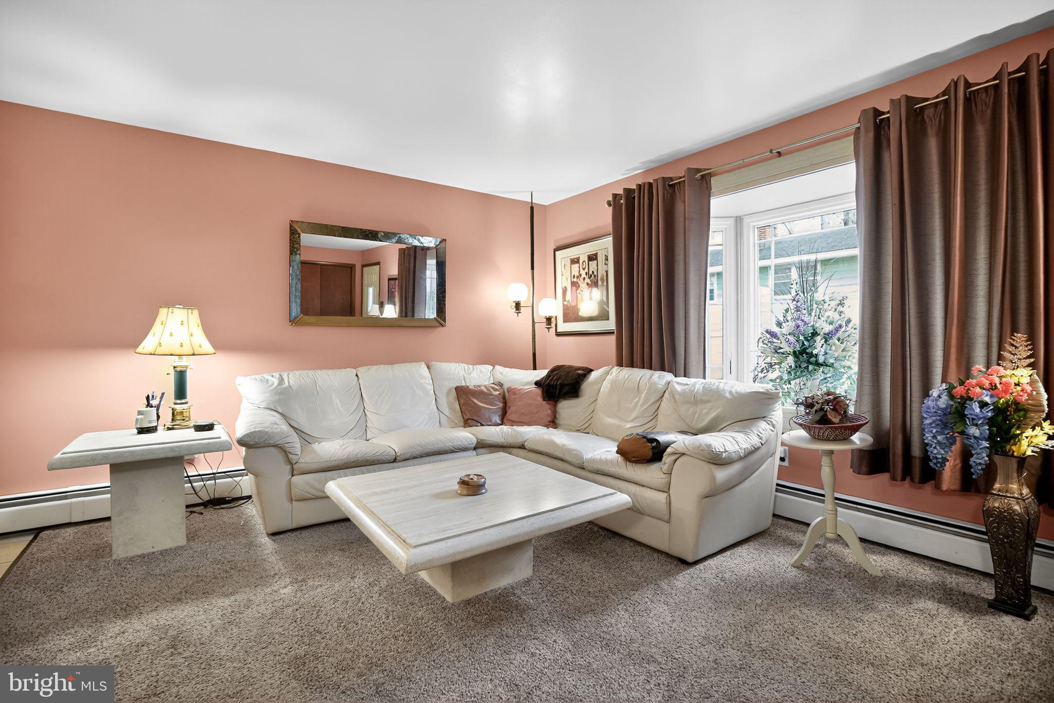 908 Pershing Road Blue Bell, PA 19422 - Photo 8 of 24 a living room with furniture and a large window