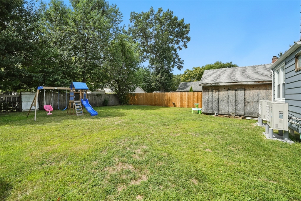 130 Eddy Street Springfield, MA 01104 - Photo 18 of 24 a view of a backyard with a garden and entertaining space