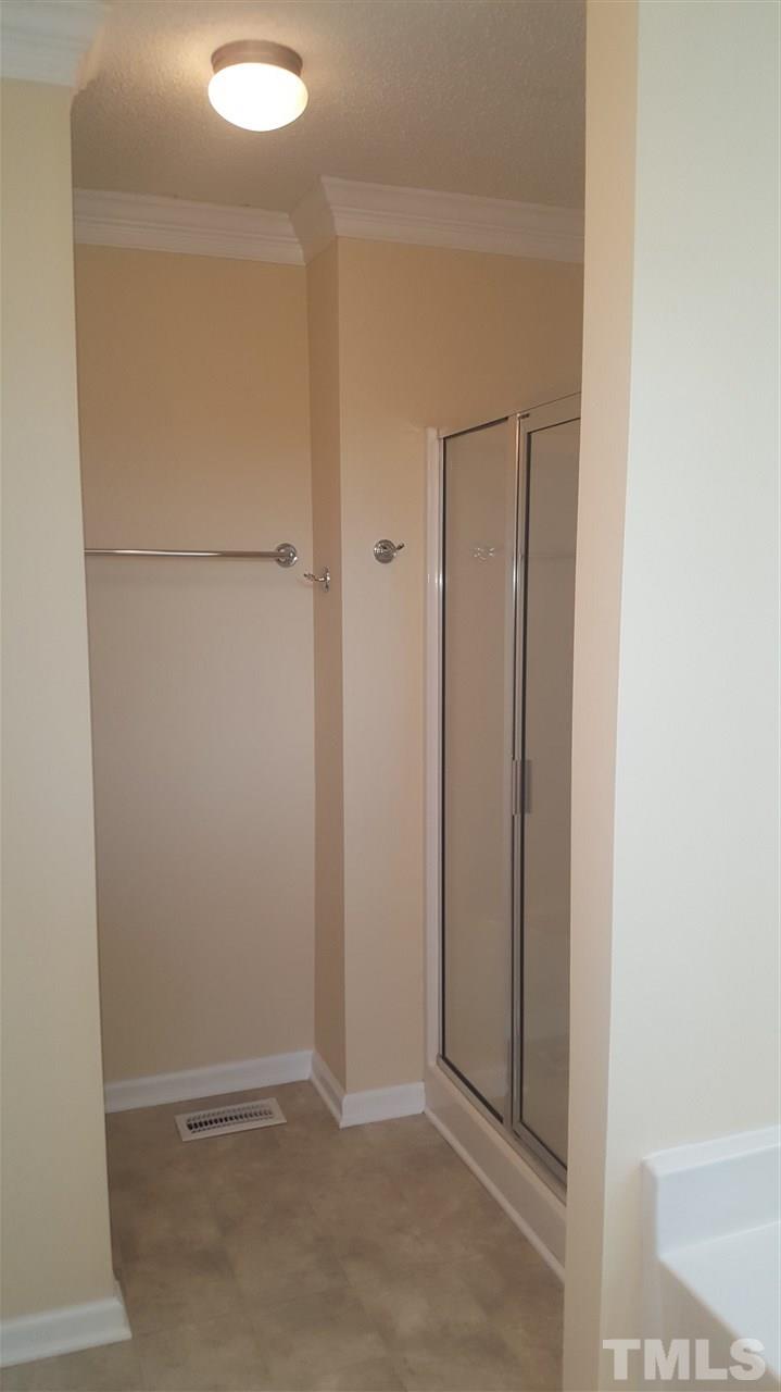 668 Slate Top House Road Clayton, NC 27520 - Photo 21 of 27 This Master Bath boasts a Walk In Shower and a Garden Tub, with Double Vanities!
