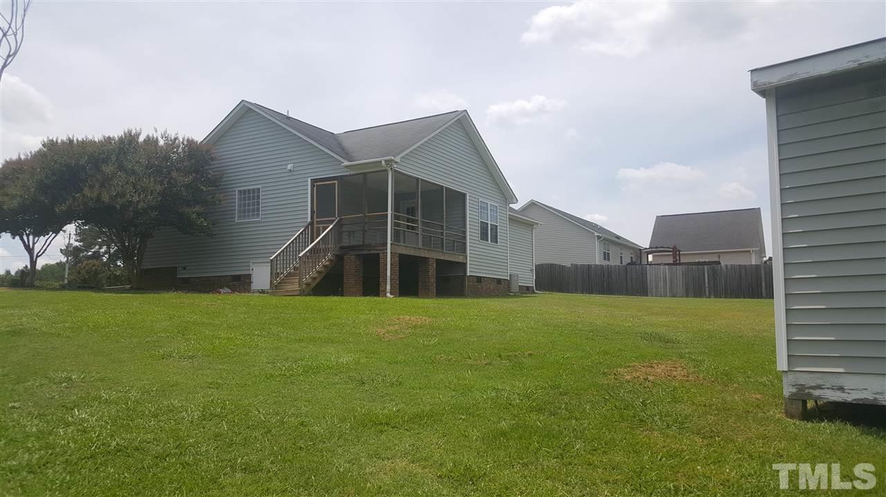 668 Slate Top House Road Clayton, NC 27520 - Photo 4 of 27 This Yard is so Spacious. One More time look at that out door living space!