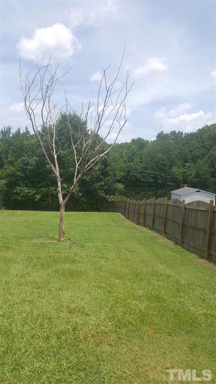 668 Slate Top House Road Clayton, NC 27520 - Photo 6 of 27 Both side Yards are spacious. Not a lot of Trees on this lot, so there is not a lot of Clean UP!! YAY!!!