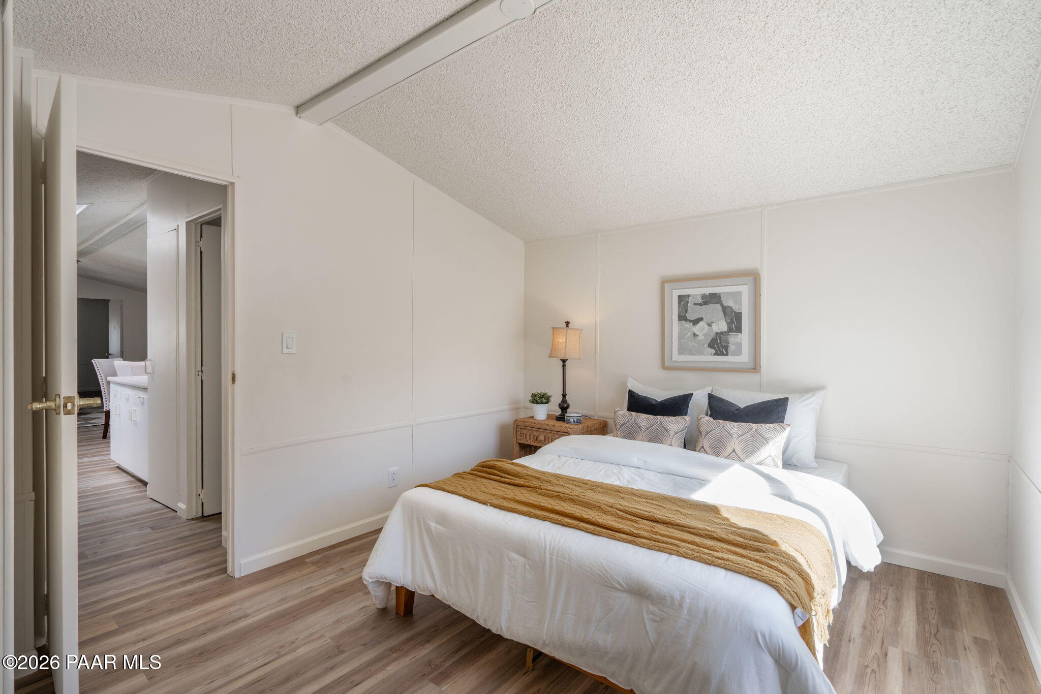 22673 Crest Way Yarnell, AZ 85362 - Photo 13 of 24 a bedroom with a bed and a painting on the wall