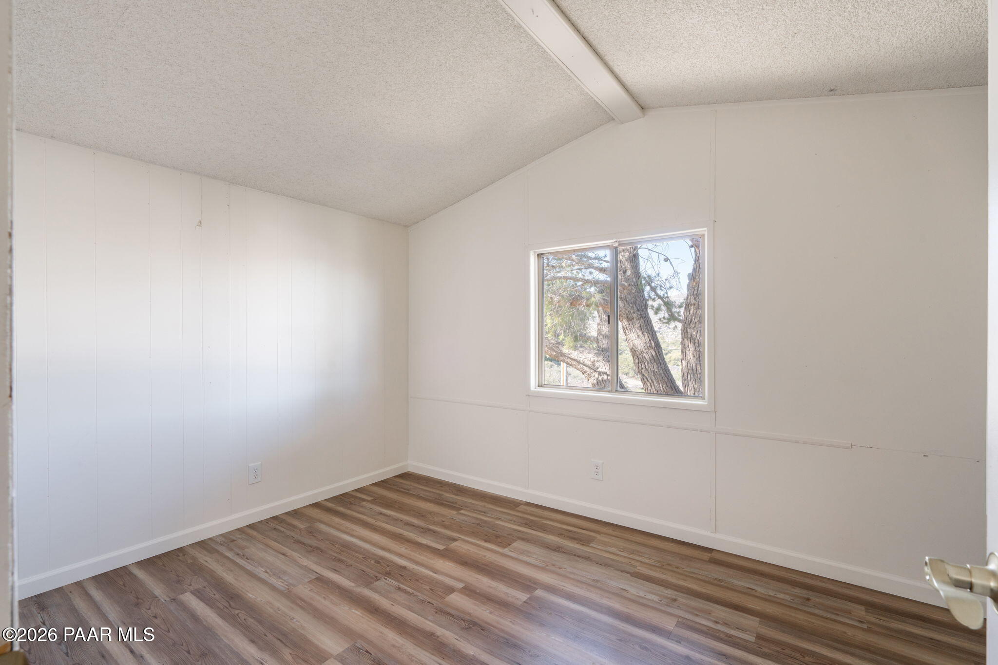 22673 Crest Way Yarnell, AZ 85362 - Photo 15 of 24 an empty room with wooden floor and windows