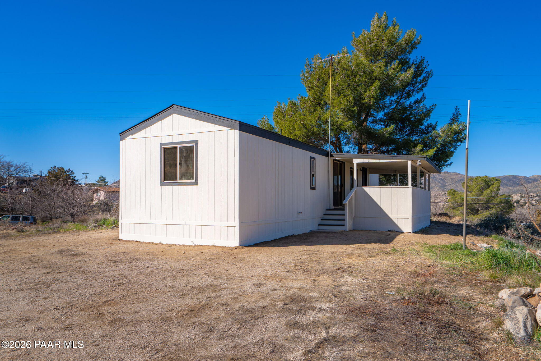22673 Crest Way Yarnell, AZ 85362 - Photo 19 of 24 a view of a house with a yard and garage