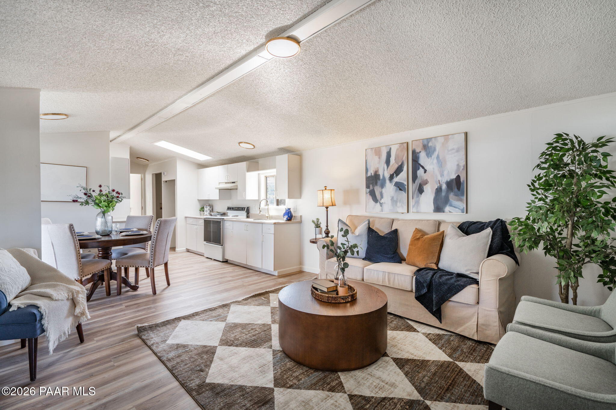 22673 Crest Way Yarnell, AZ 85362 - Photo 2 of 24 a living room with furniture and a potted plant