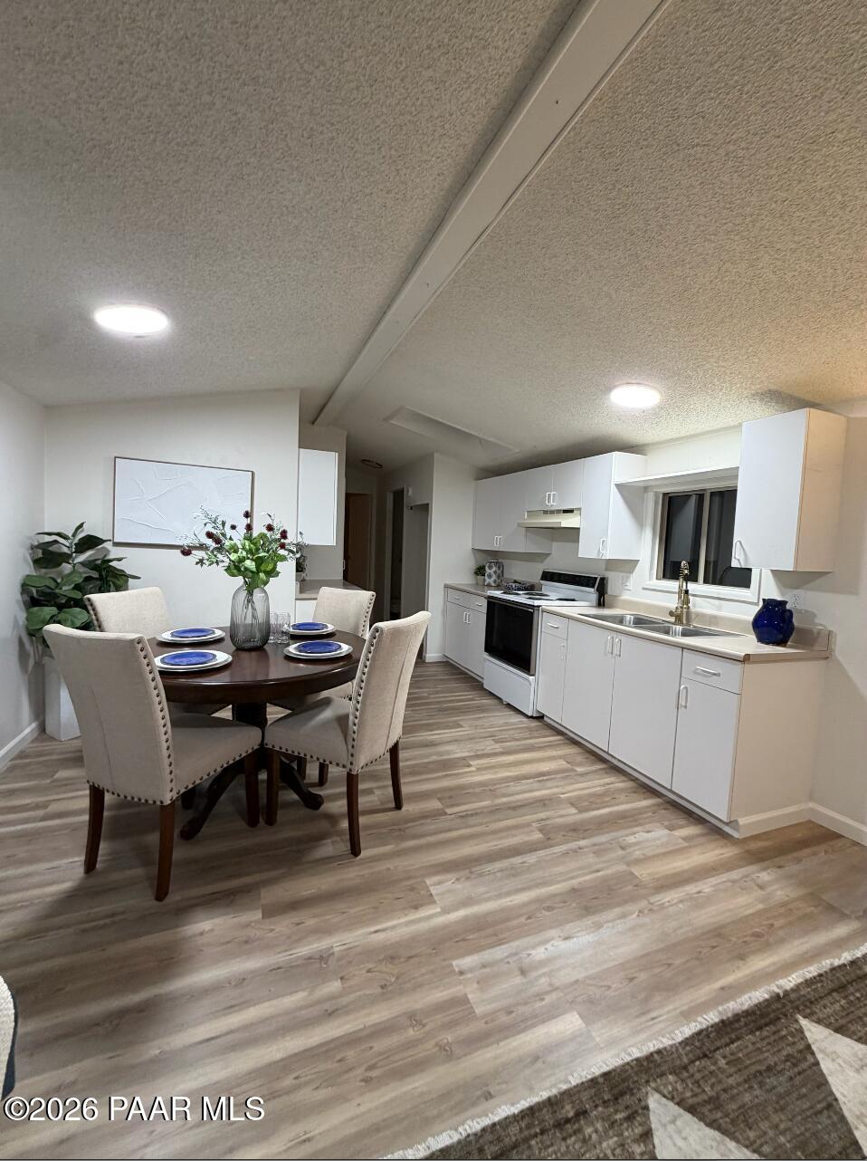 22673 Crest Way Yarnell, AZ 85362 - Photo 4 of 24 a view of a dining room with furniture and wooden floor