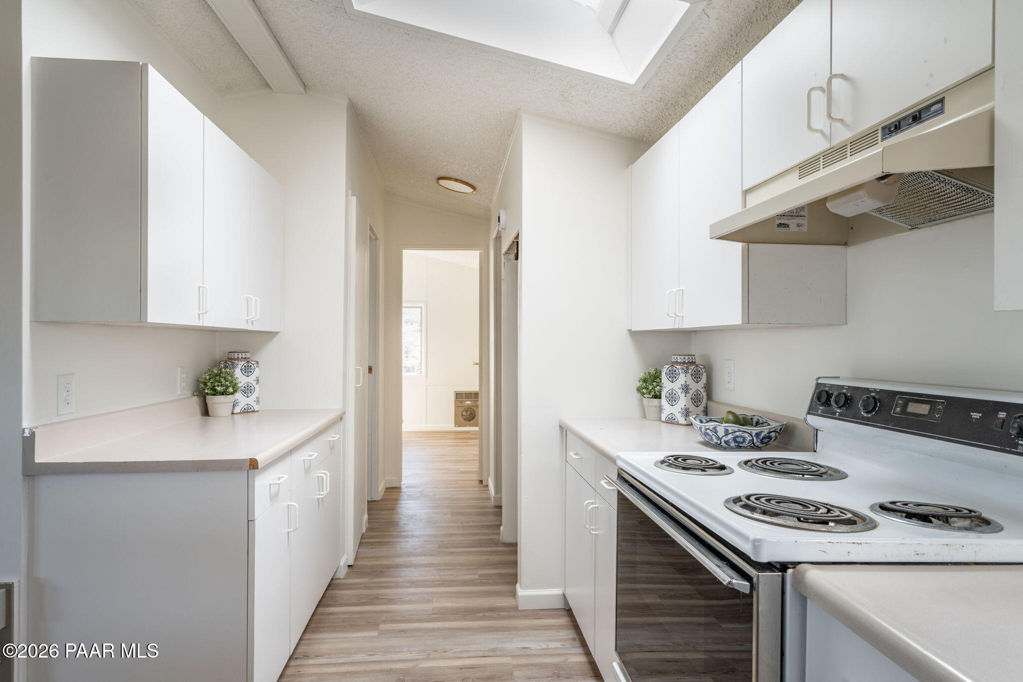 22673 Crest Way Yarnell, AZ 85362 - Photo 5 of 24 a kitchen with stainless steel appliances a stove a sink and a refrigerator