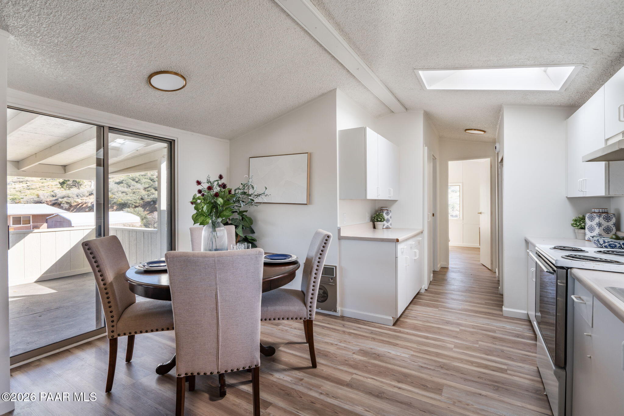 22673 Crest Way Yarnell, AZ 85362 - Photo 7 of 24 a view of a dining room with furniture and wooden floor
