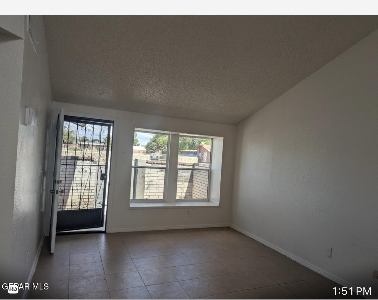 8138 St Andrew Lane, Unit ABCD El Paso, TX 79907 - Photo 14 of 18 a view of an empty room with a window
