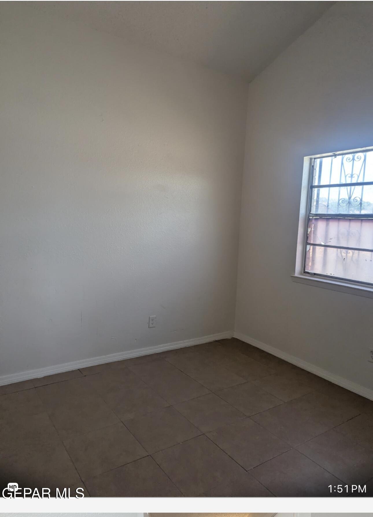 8138 St Andrew Lane, Unit ABCD El Paso, TX 79907 - Photo 15 of 18 an empty room with a window