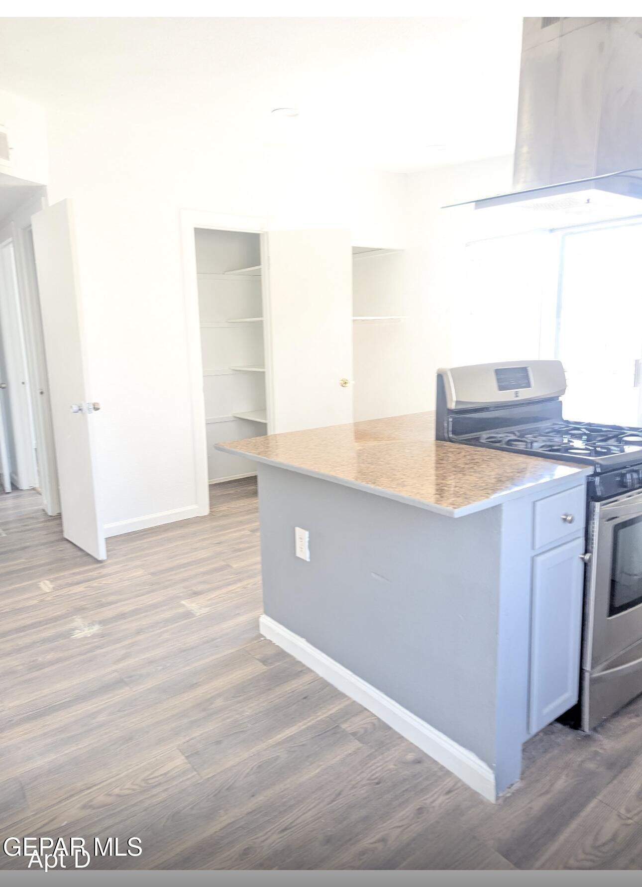 8138 St Andrew Lane, Unit ABCD El Paso, TX 79907 - Photo 18 of 18 a kitchen with granite countertop white cabinets and white appliances
