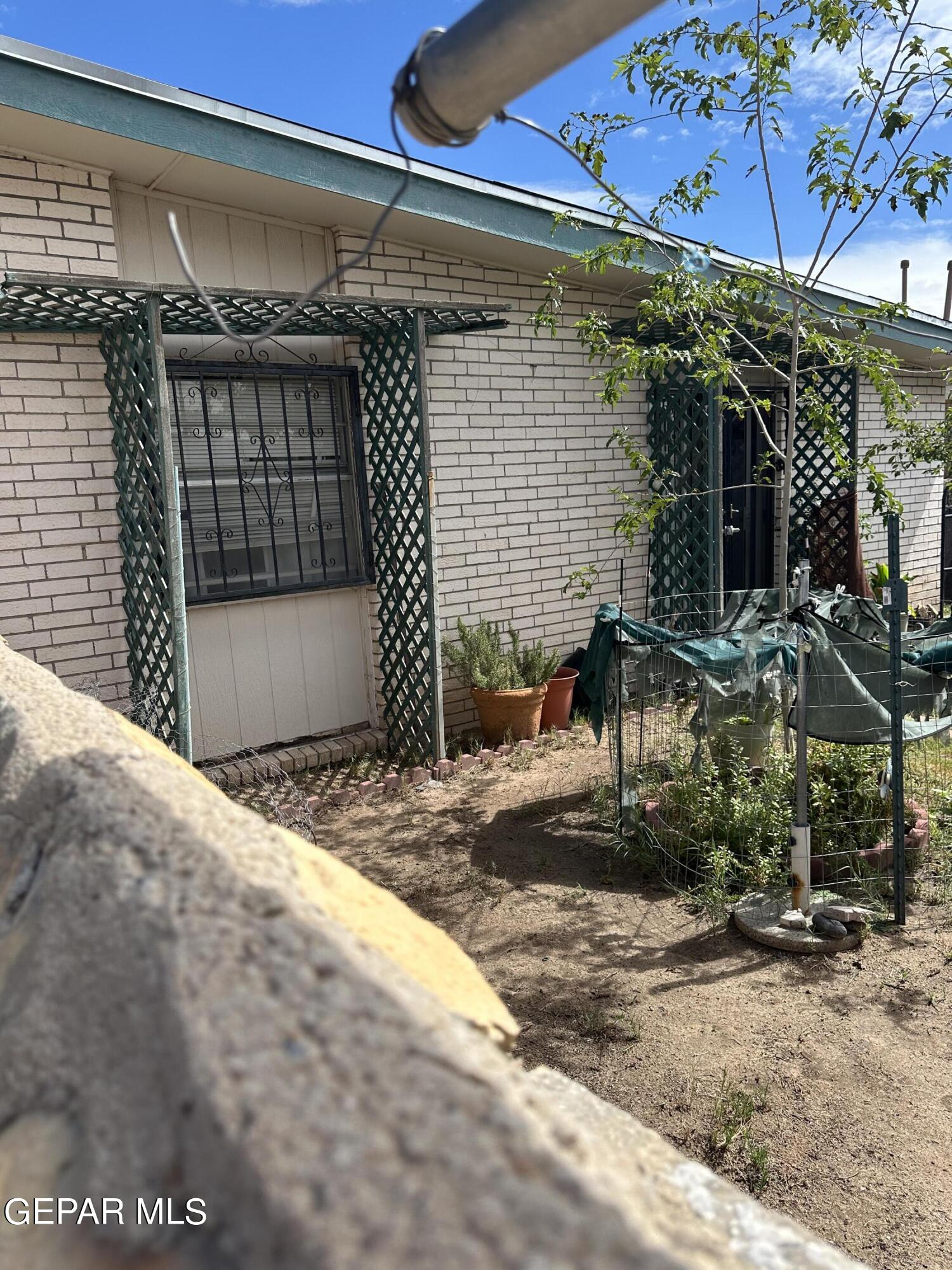 8138 St Andrew Lane, Unit ABCD El Paso, TX 79907 - Photo 5 of 18 a front view of a house with garage