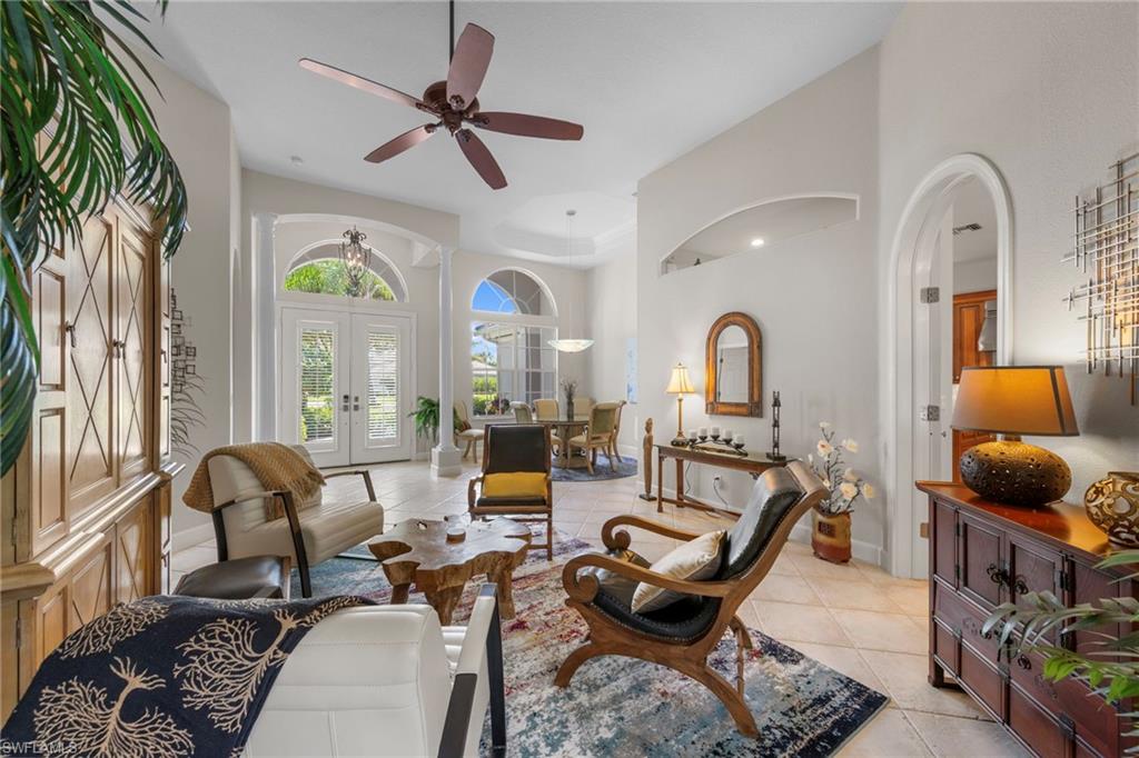 22043 Sycamore Grove Estero, FL 34135 - Photo 11 of 44 a living room with furniture fireplace and a large window
