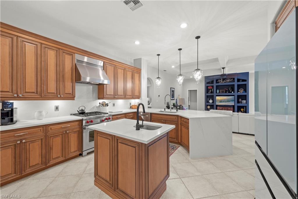 22043 Sycamore Grove Estero, FL 34135 - Photo 14 of 44 a kitchen with a sink window and cabinets