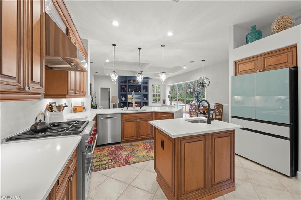 22043 Sycamore Grove Estero, FL 34135 - Photo 15 of 44 a kitchen with a sink stove and cabinets