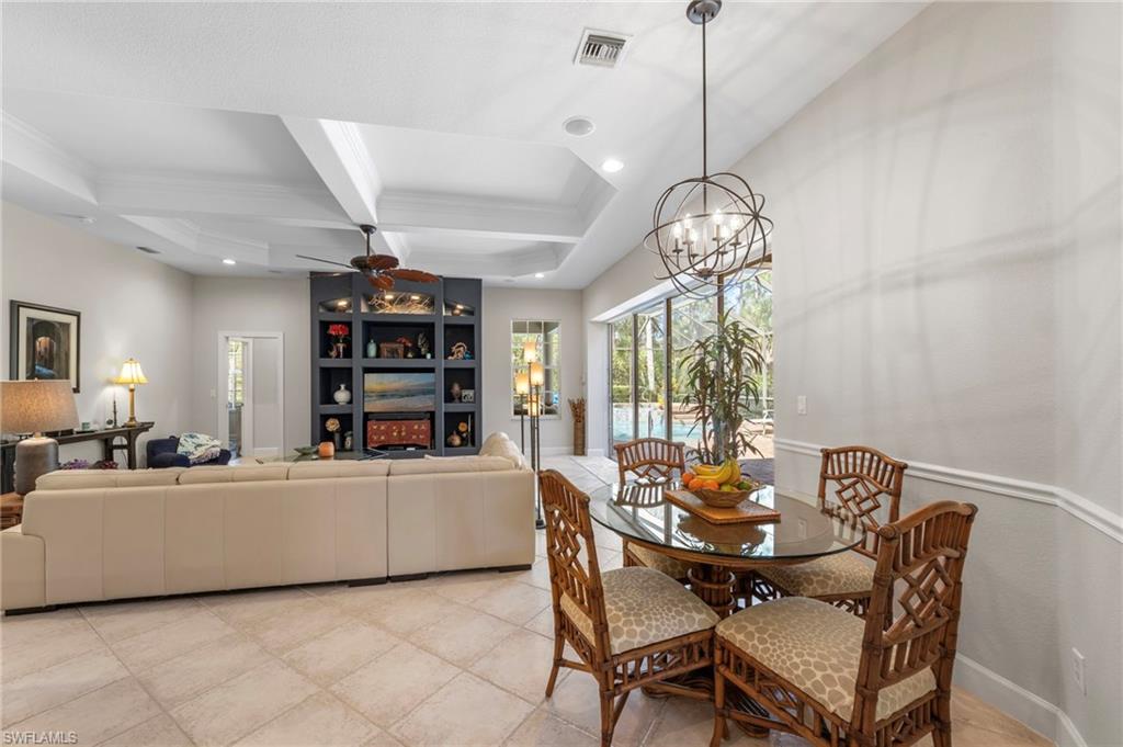 22043 Sycamore Grove Estero, FL 34135 - Photo 17 of 44 a dining room with furniture and a large window