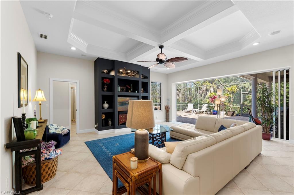 22043 Sycamore Grove Estero, FL 34135 - Photo 19 of 44 a living room with furniture fireplace and a large window
