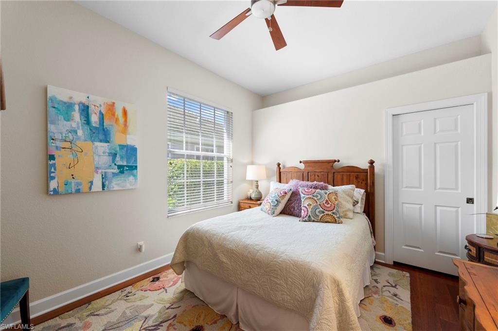 22043 Sycamore Grove Estero, FL 34135 - Photo 22 of 44 a bedroom with a bed and a window