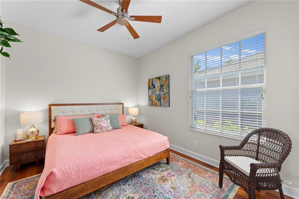 22043 Sycamore Grove Estero, FL 34135 - Photo 24 of 44 a bedroom with a bed chair and window