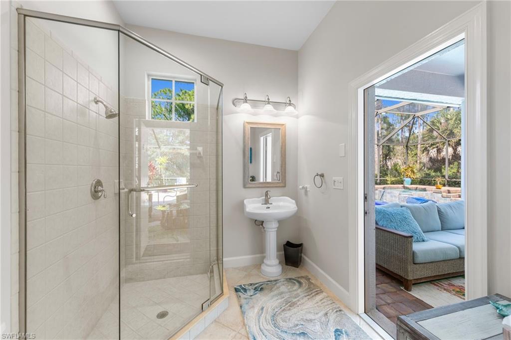 22043 Sycamore Grove Estero, FL 34135 - Photo 25 of 44 a bathroom with a shower and a toilet