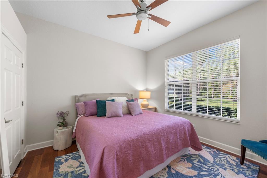 22043 Sycamore Grove Estero, FL 34135 - Photo 26 of 44 a bedroom with a large bed and a window
