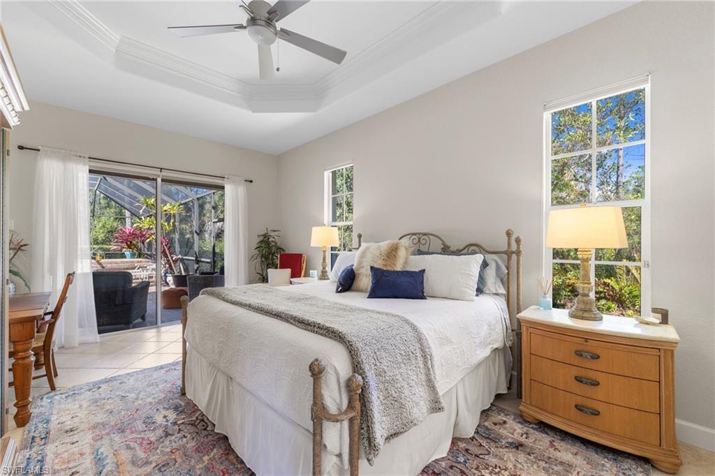 22043 Sycamore Grove Estero, FL 34135 - Photo 27 of 44 a bedroom with a bed and a window