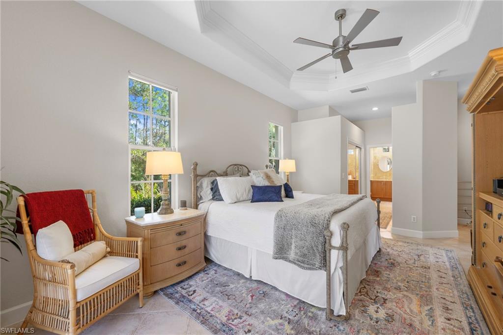 22043 Sycamore Grove Estero, FL 34135 - Photo 28 of 44 a bed room with a bed a couch and a window