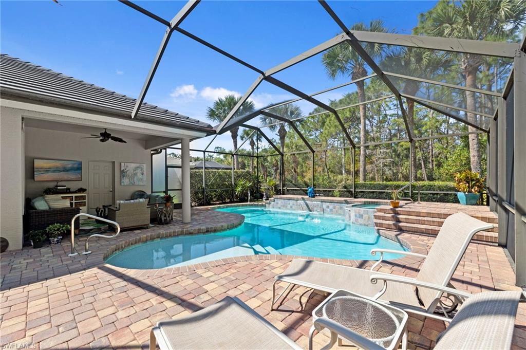 22043 Sycamore Grove Estero, FL 34135 - Photo 35 of 44 a view of a swimming pool with a patio