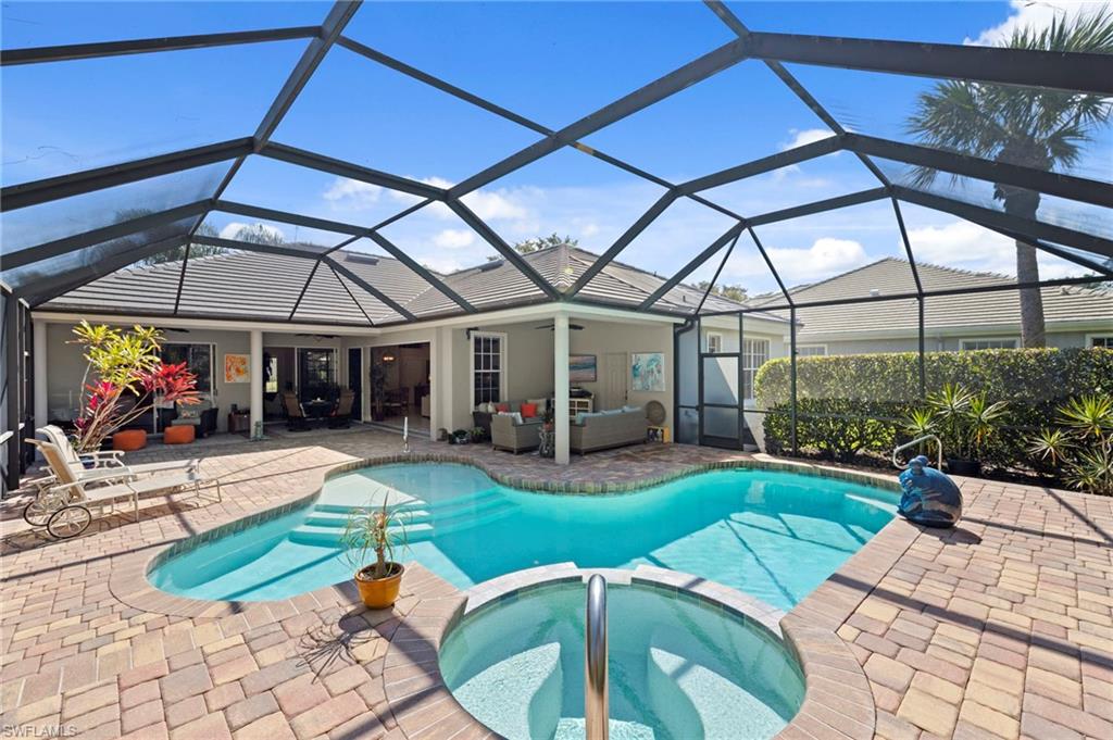 22043 Sycamore Grove Estero, FL 34135 - Photo 36 of 44 a view of a house with a yard patio and a backyard
