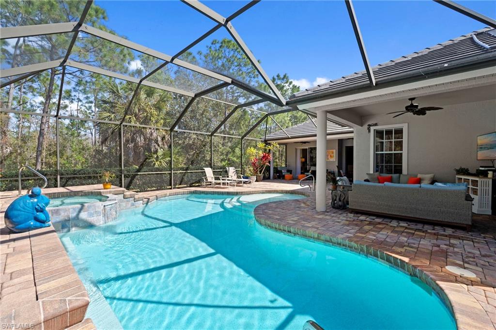 22043 Sycamore Grove Estero, FL 34135 - Photo 37 of 44 a view of a backyard with a patio