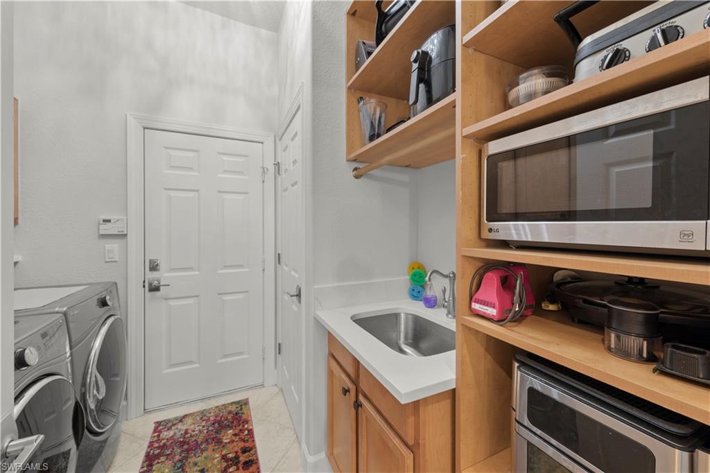 22043 Sycamore Grove Estero, FL 34135 - Photo 44 of 44 a utility room with dryer and washer