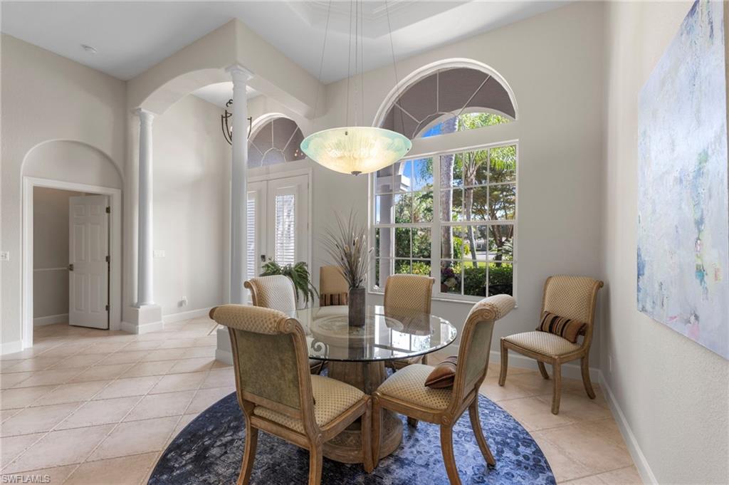 22043 Sycamore Grove Estero, FL 34135 - Photo 8 of 44 a dining room with furniture and wooden floor