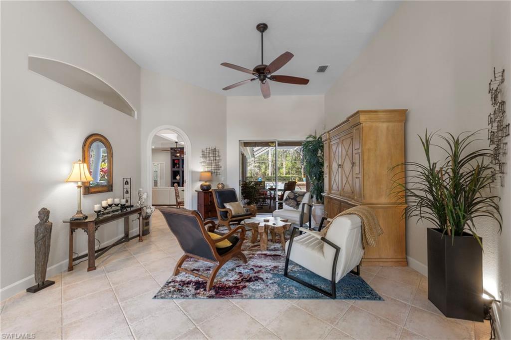 22043 Sycamore Grove Estero, FL 34135 - Photo 10 of 44 a living room with furniture a couch and a chandelier