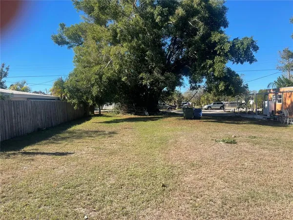 a view of street with parked cars