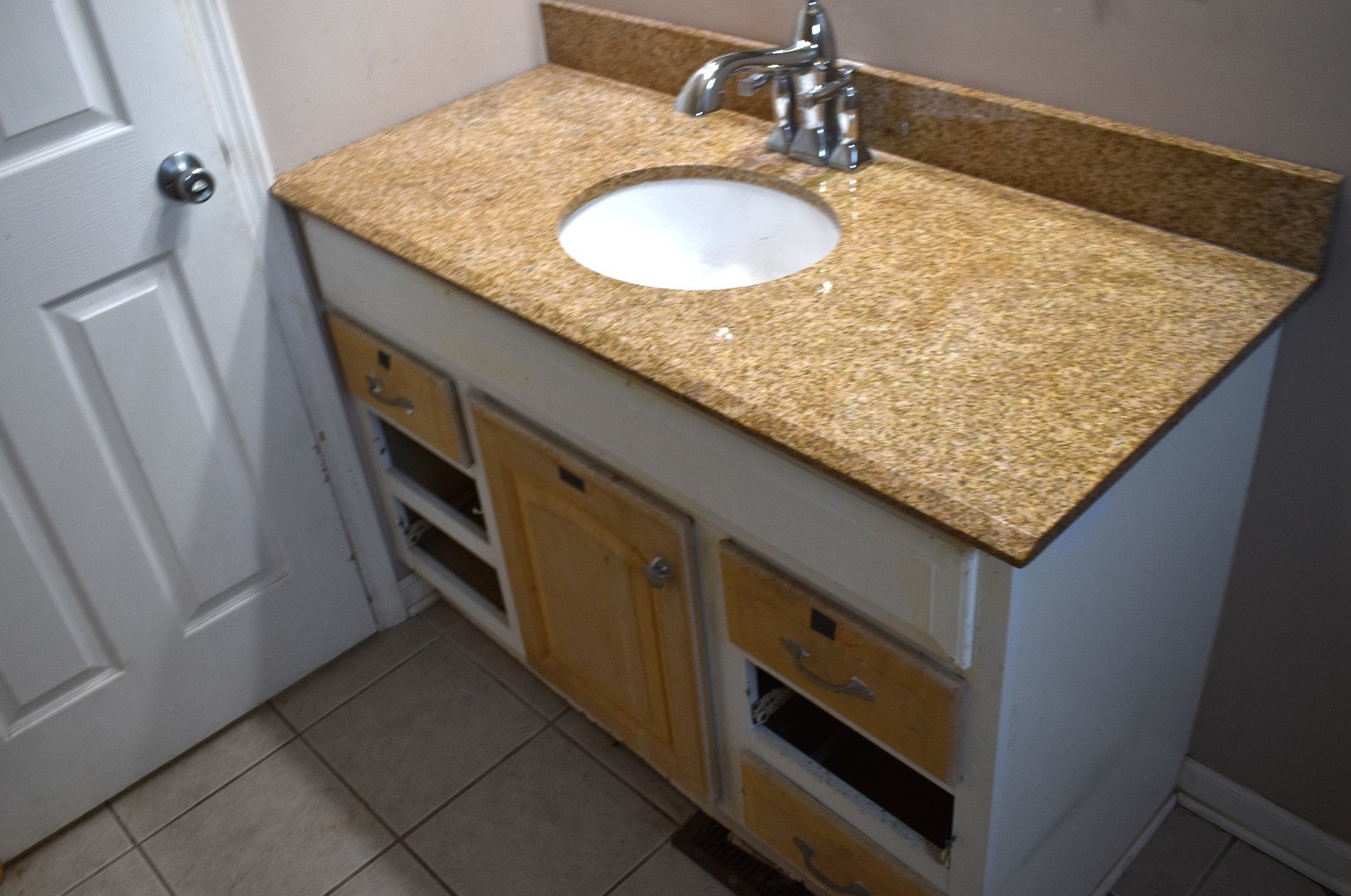 1650 Marquette Road Joliet, IL 60435 - Photo 12 of 20 a bathroom with a granite countertop sink and a mirror