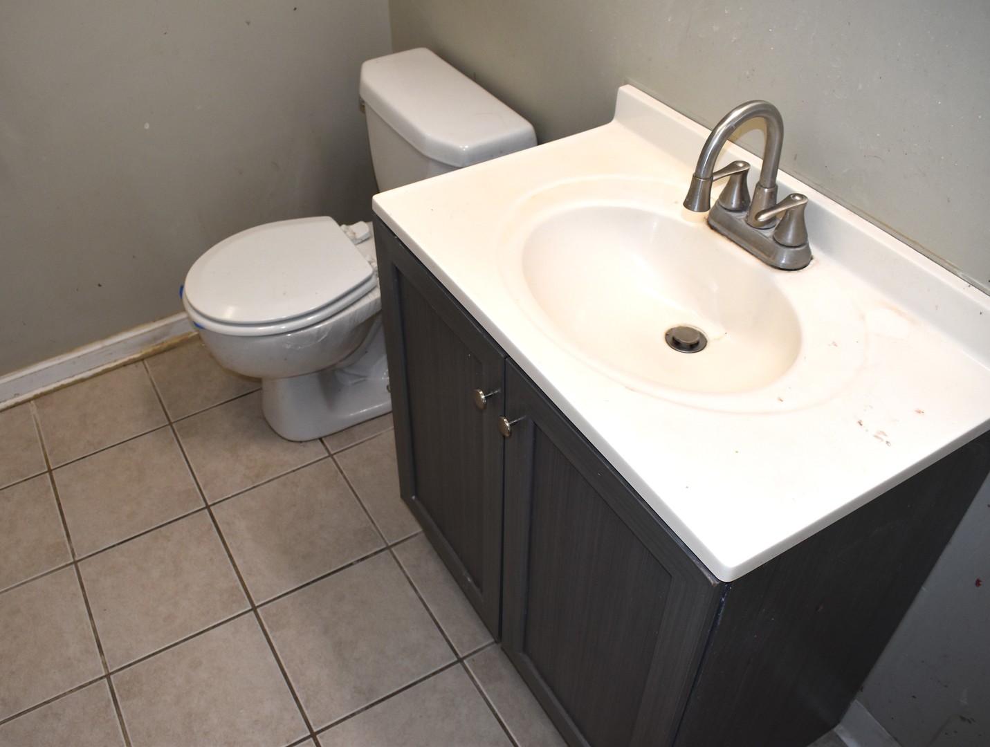 1650 Marquette Road Joliet, IL 60435 - Photo 14 of 20 a bathroom with a sink a toilet and mirror