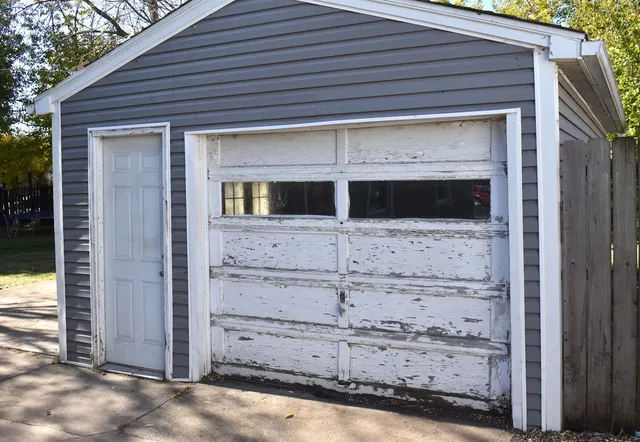 a front view of a house with parking space