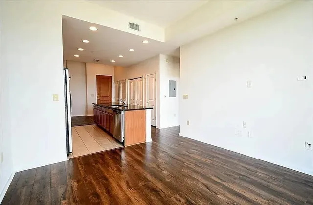 a view of a kitchen with wooden floor