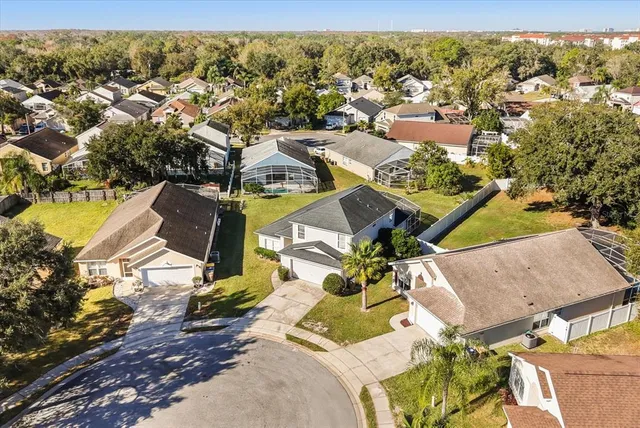 an aerial view of residential houses with outdoor space