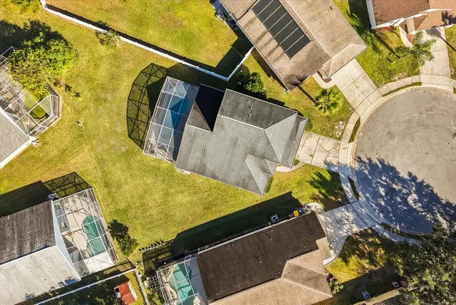 a view of a swimming pool with potted plants