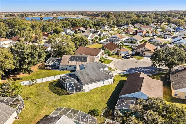 an aerial view of a house with a swimming pool